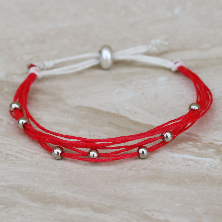 Used with cord to make a sliding knot closure