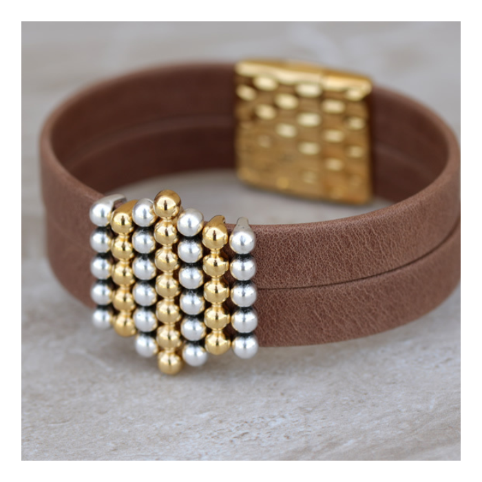 In this design, waxed cord is used to secure the sliders