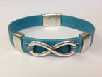 slider attached with 1mm leather cord, knotted through a hole punched in the flat leather