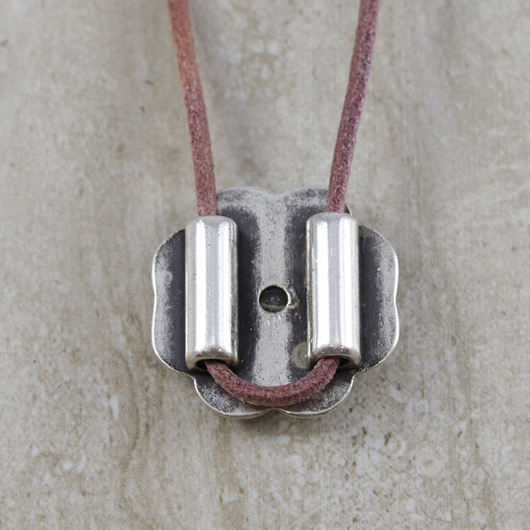 Can be used as a pendant by looping leather through the bead holes