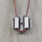 Can be used as a pendant by looping leather through the bead holes