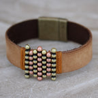 In this design, waxed cord is used to secure the sliders
