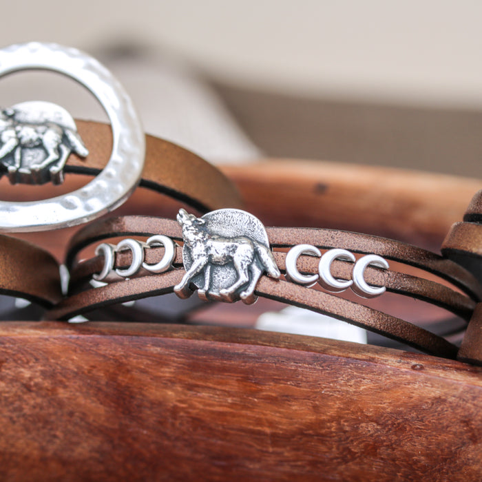 Bracelet features 10mm Howling Wolf, 3mm Crescent Moons and Three strands of 3mm Flat Leather